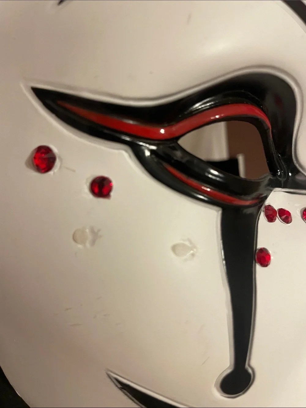 Dirty, scary Jack-in-box Halloween costume or cosplay, including jeweled mask.